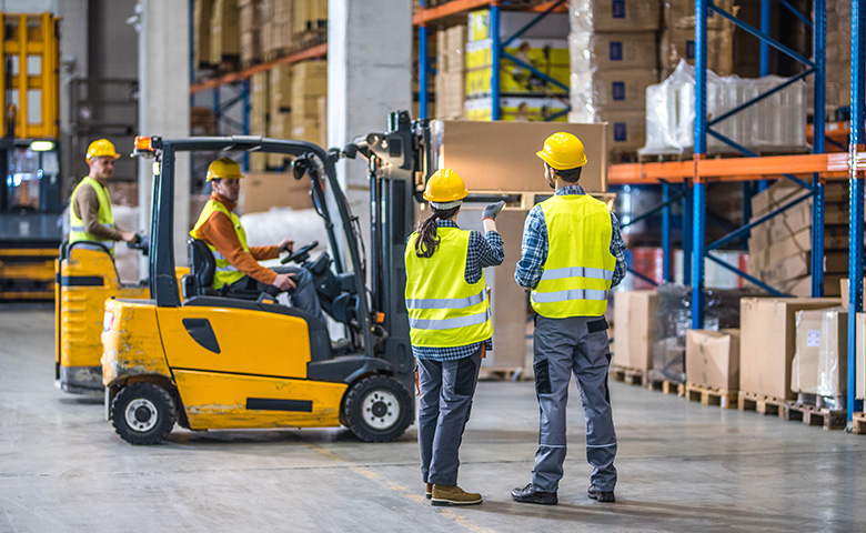 Manual workers working in warehouse